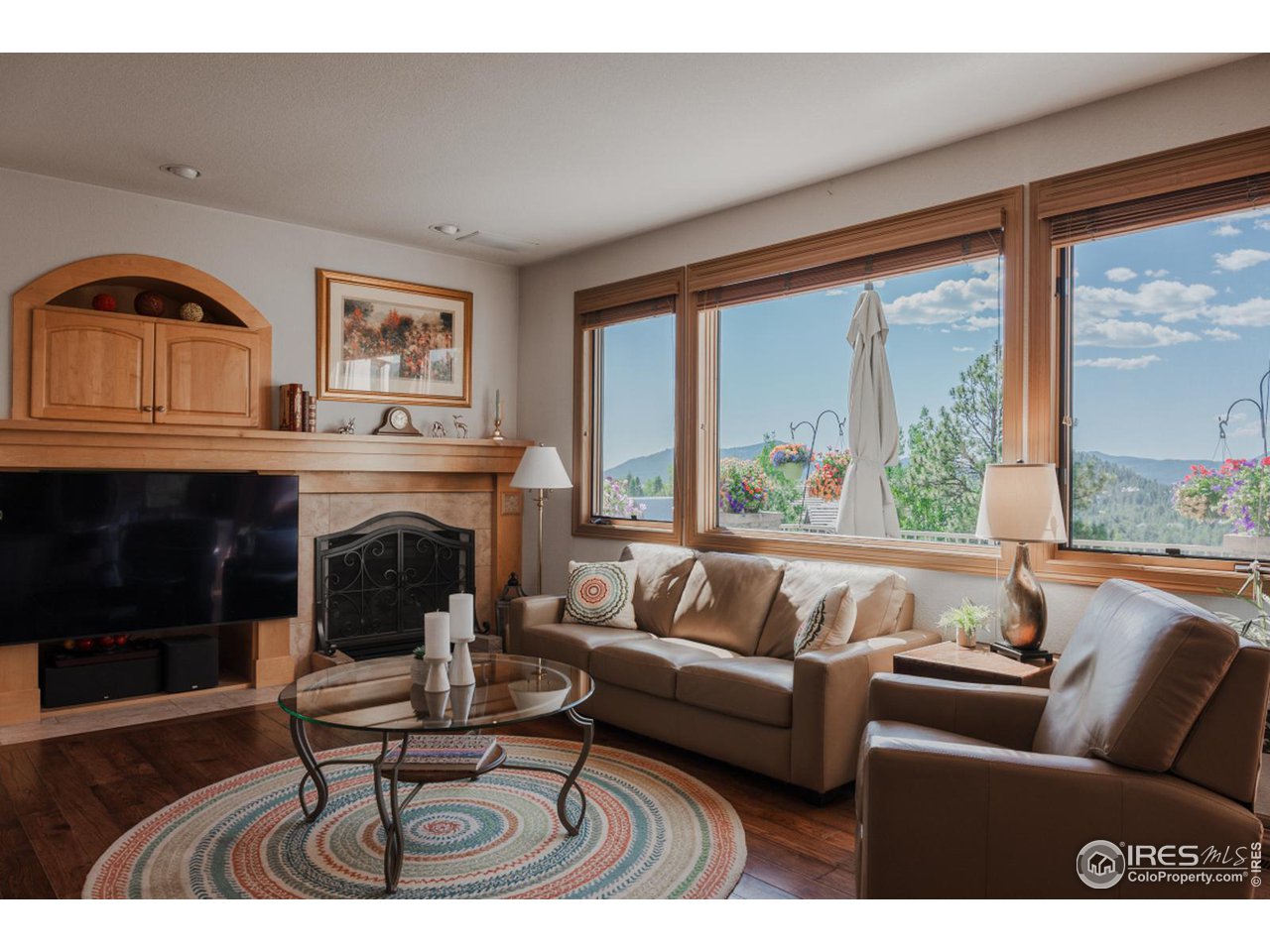 2964 Elk View Drive Evergreen, CO 80439 - Photo 18 of 40 a living room with furniture and a fireplace