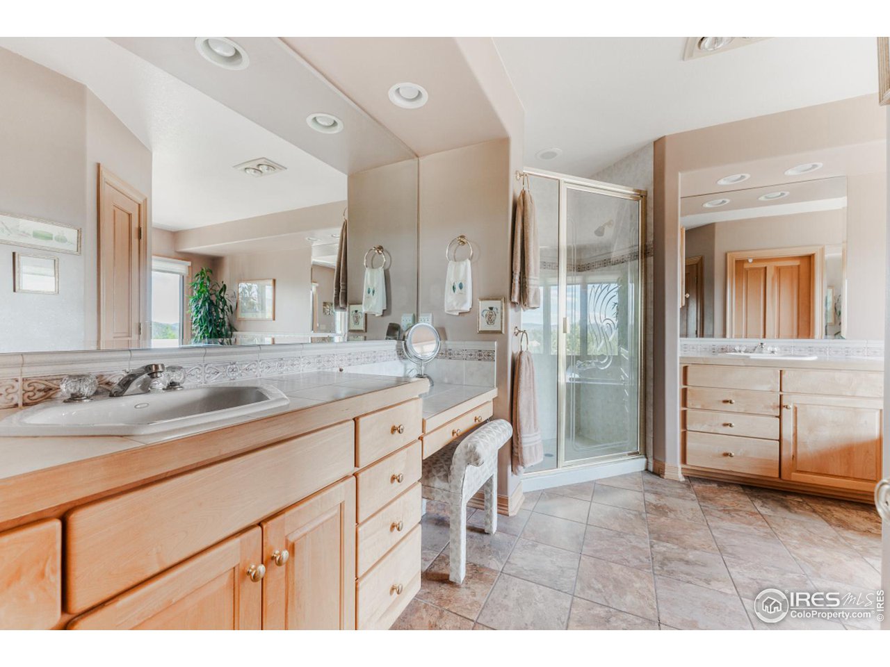 2964 Elk View Drive Evergreen, CO 80439 - Photo 26 of 40 a bathroom with a granite countertop sink mirror and double