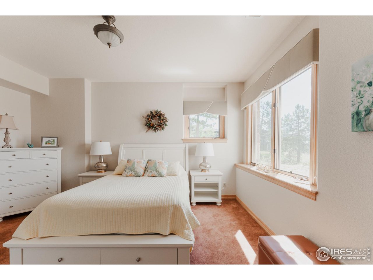 2964 Elk View Drive Evergreen, CO 80439 - Photo 34 of 40 a bedroom with a bed and a large window