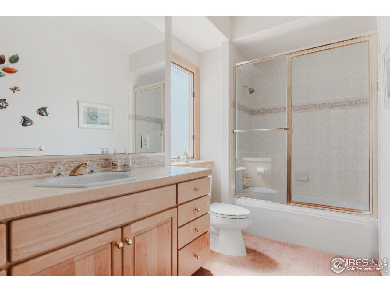2964 Elk View Drive Evergreen, CO 80439 - Photo 35 of 40 a bathroom with a granite countertop sink a toilet and shower