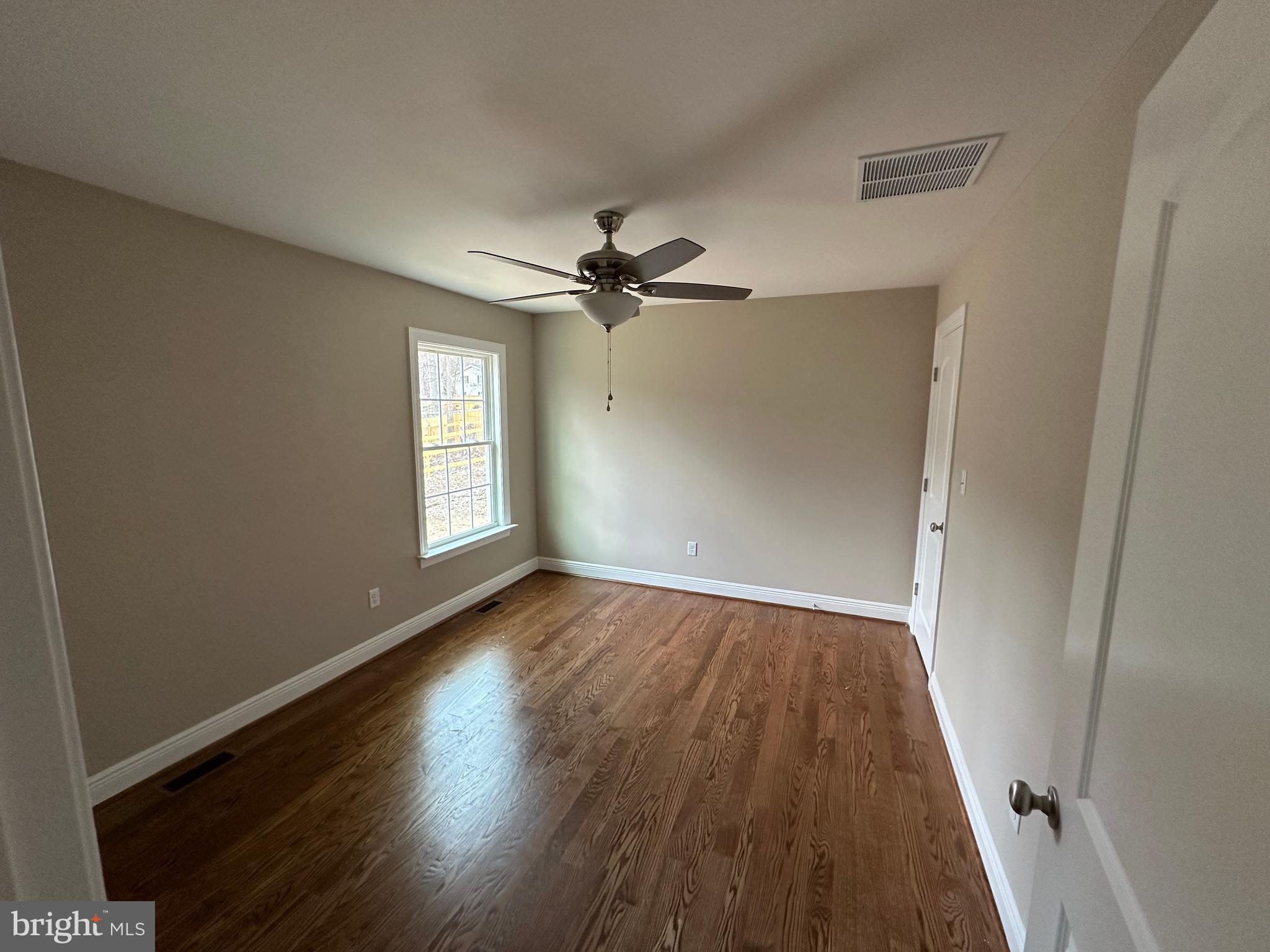 116 Pinto Winchester, VA 22602 - Photo 16 of 23 wooden floor in an empty room with a window
