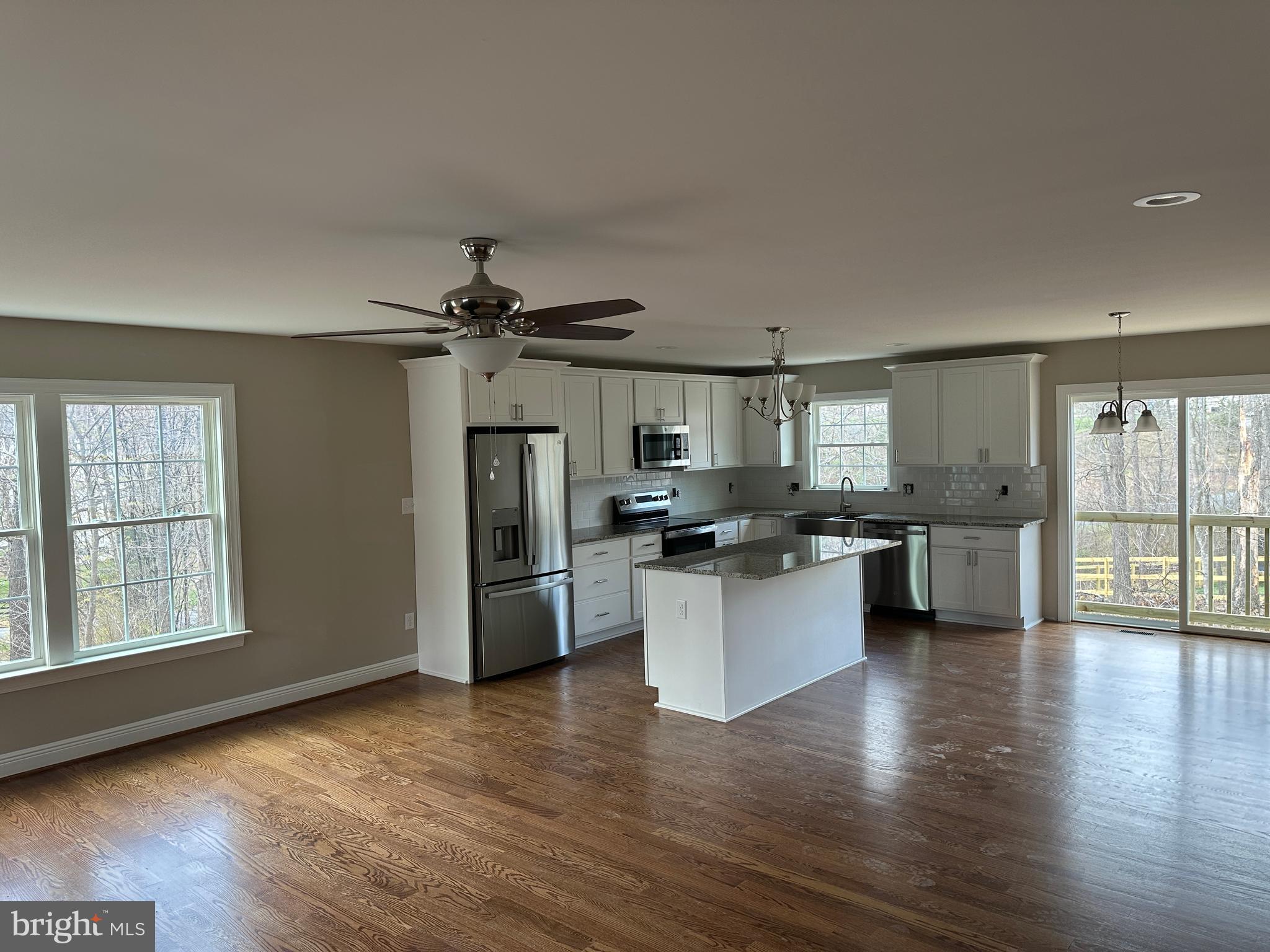 116 Pinto Winchester, VA 22602 - Photo 6 of 23 a kitchen with sink cabinets and wooden floor