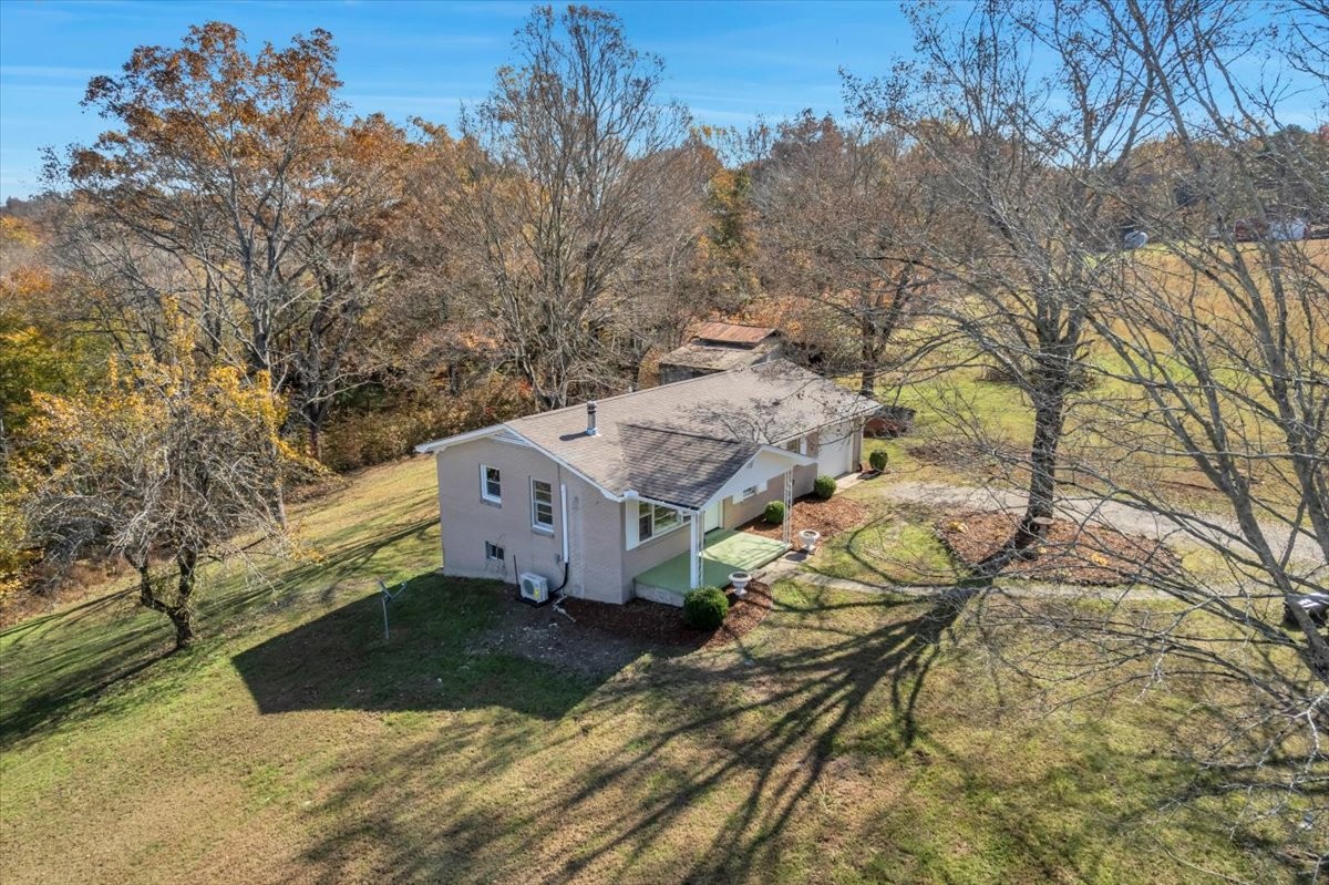 390 Junus Jackson Hollow Road Minor Hill, TN 38473 - Photo 27 of 38 a view of a house with a yard