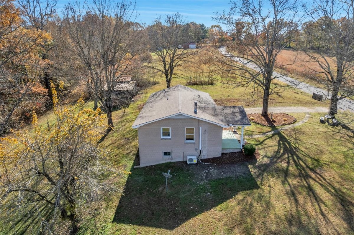 390 Junus Jackson Hollow Road Minor Hill, TN 38473 - Photo 28 of 38 a view of a house with a yard