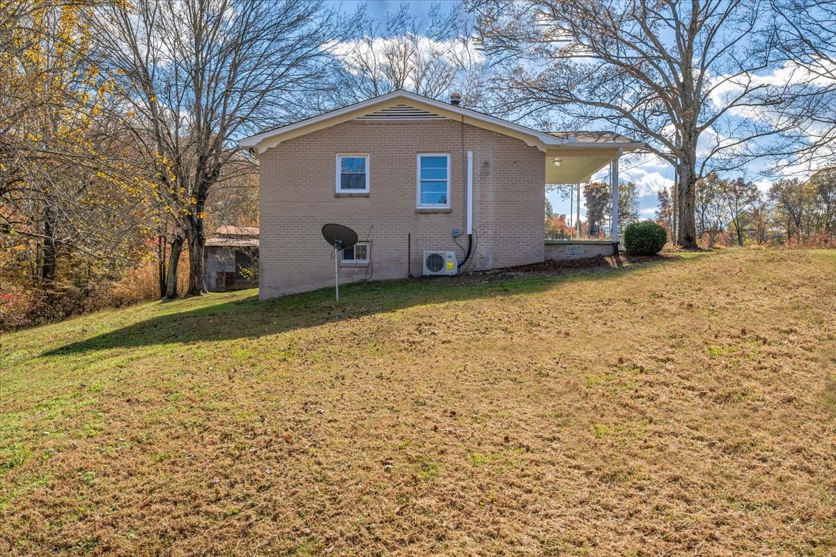 390 Junus Jackson Hollow Road Minor Hill, TN 38473 - Photo 3 of 38 a view of a house with a yard