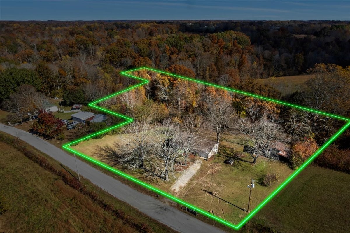 390 Junus Jackson Hollow Road Minor Hill, TN 38473 - Photo 31 of 38 a view of a backyard with wooden fence