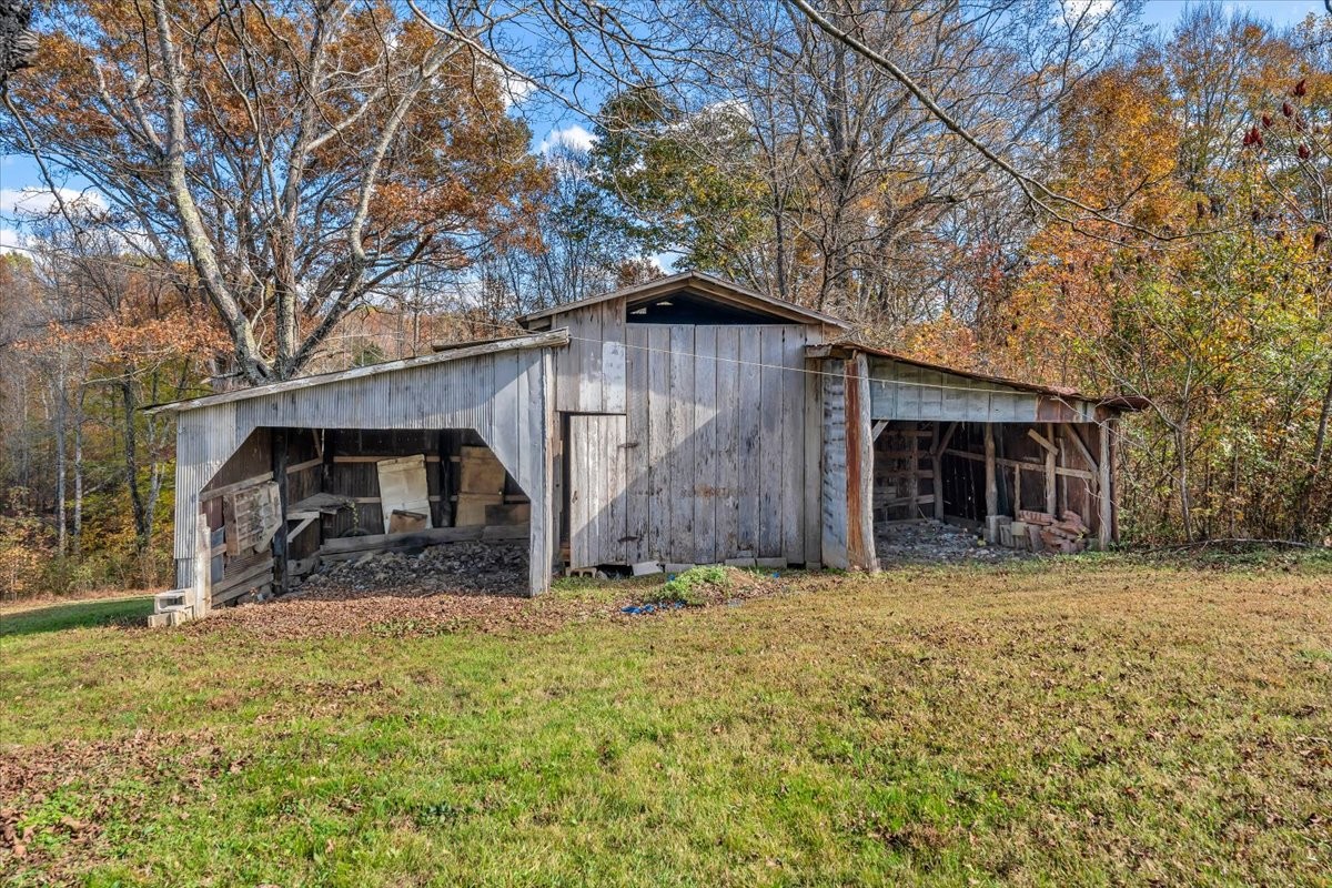 390 Junus Jackson Hollow Road Minor Hill, TN 38473 - Photo 7 of 38 a view of a house with a yard