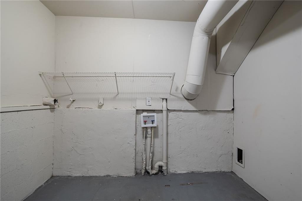 5449 Martins Crossing Road Stone Mountain, GA 30088 - Photo 11 of 32 a view of a room with racks on the wall