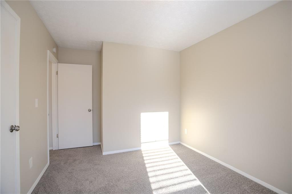 5449 Martins Crossing Road Stone Mountain, GA 30088 - Photo 15 of 32 a view of an empty room
