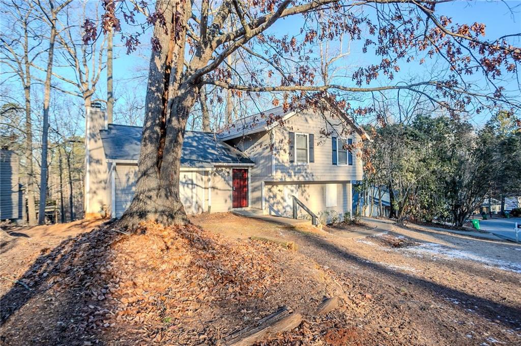 5449 Martins Crossing Road Stone Mountain, GA 30088 - Photo 2 of 32 a view of a house with a snow in the yard