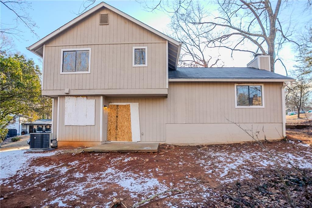 5449 Martins Crossing Road Stone Mountain, GA 30088 - Photo 23 of 32 a view of a house with a yard