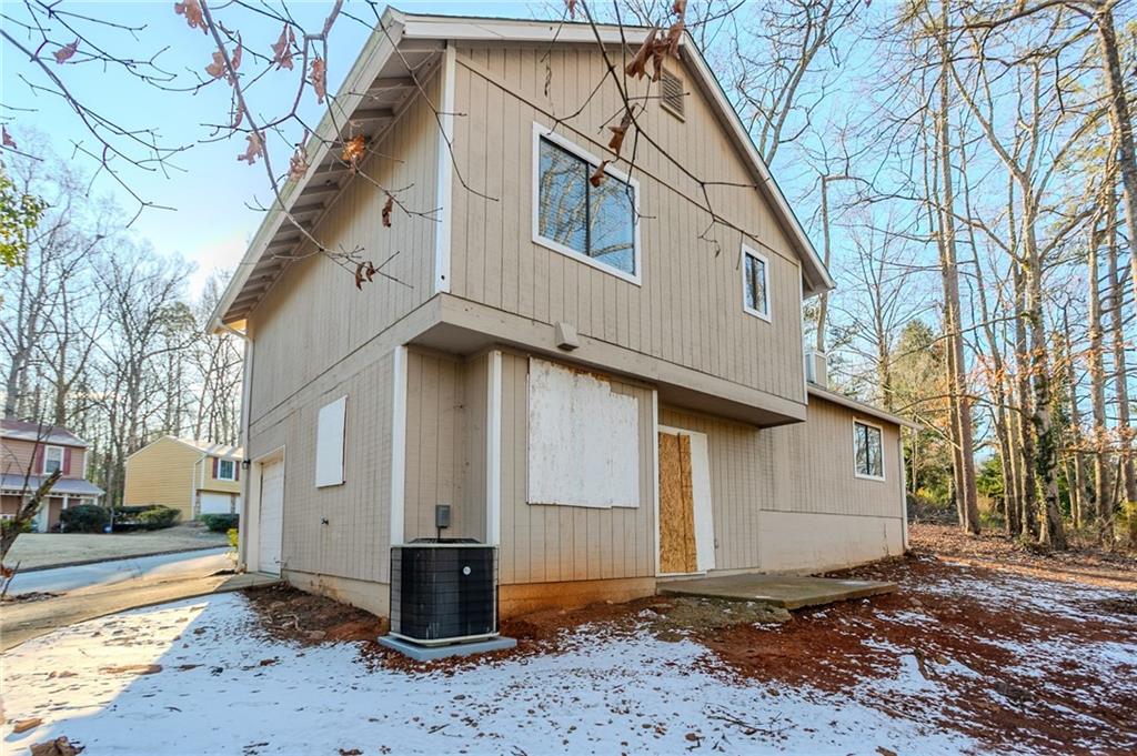 5449 Martins Crossing Road Stone Mountain, GA 30088 - Photo 24 of 32 a front view of a house with a yard