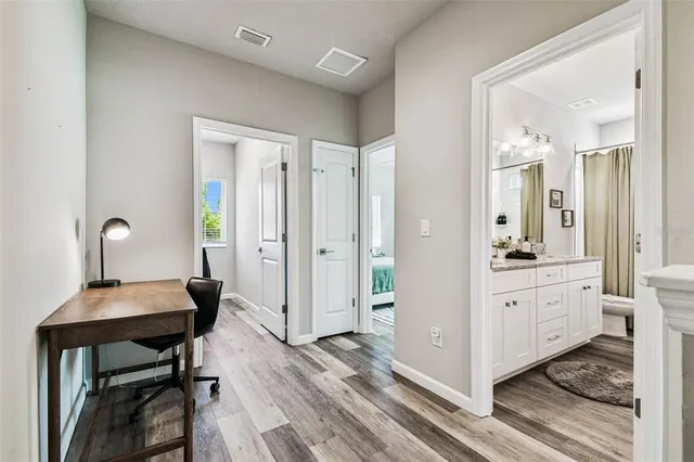 a workspace with furniture and window