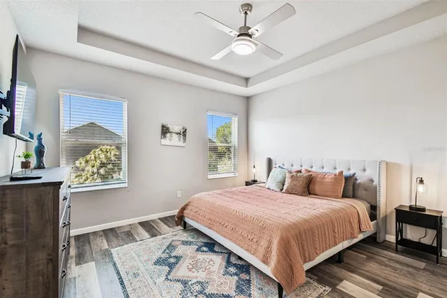 a bedroom with a large bed and a window