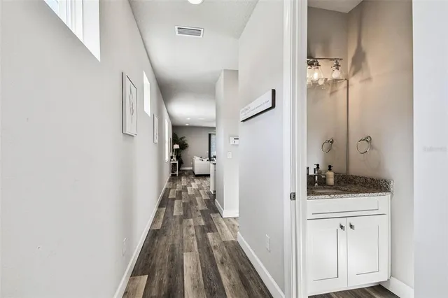 a view of a bathroom from a hallway