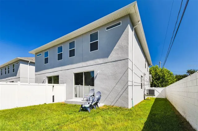 a view of house with backyard porch and garden