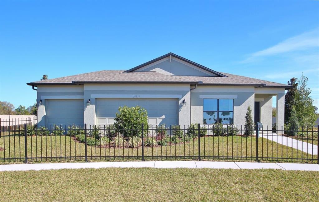 18912 Diego Circle Spring Hill, FL 34610 - Photo 1 of 1 a front view of a house with a porch