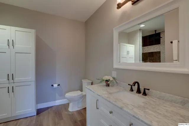 a bedroom with a bed and a couch