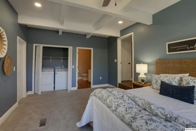 a view of a balcony with wooden floor and fence