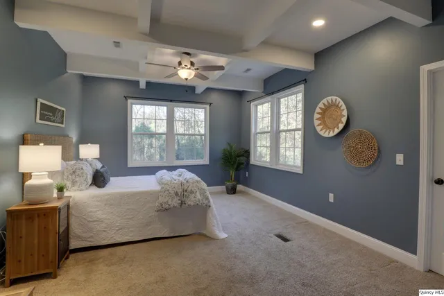 a bed room with a bed and a window