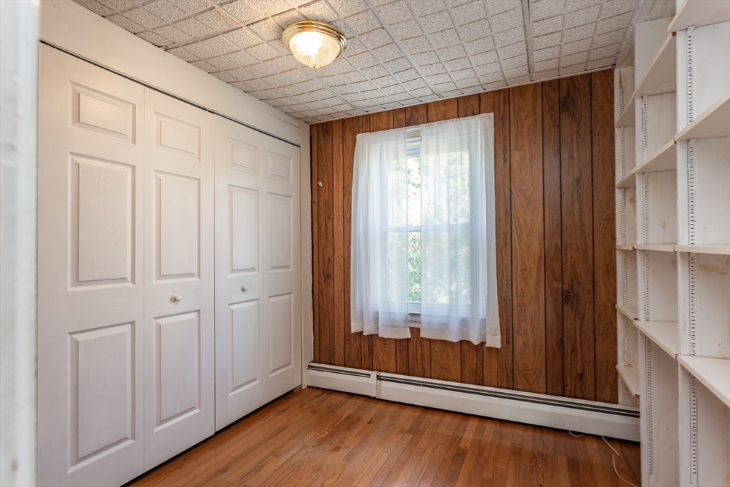 724 High Street Fall River, MA 02720 - Photo 24 of 39 an empty room with wooden floor and windows