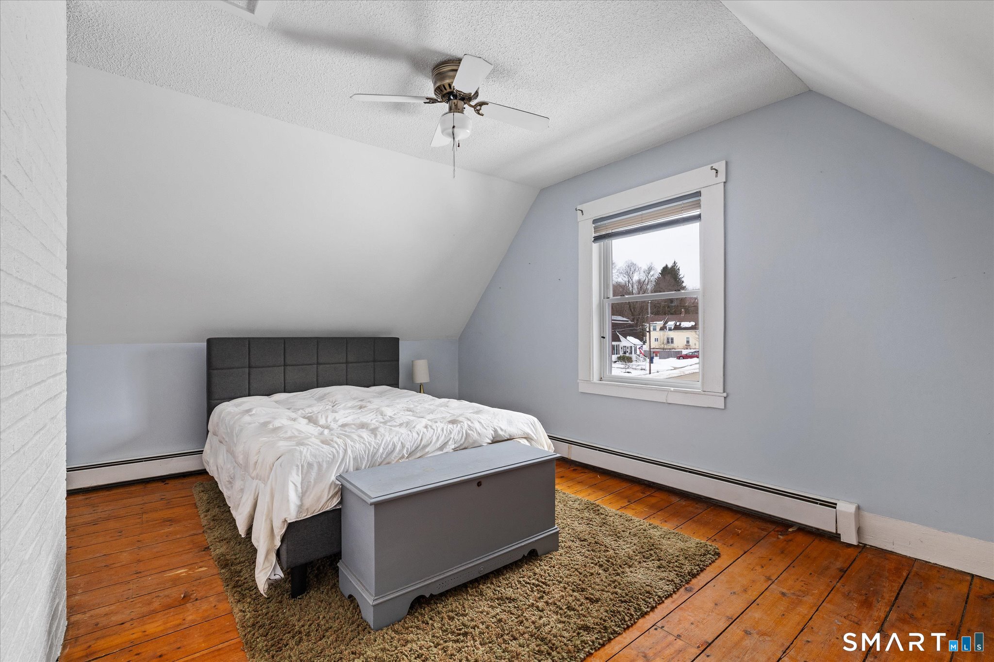 119 Quercus Avenue Windham, CT 06226 - Photo 19 of 30 a bed sitting in a bedroom next to a window