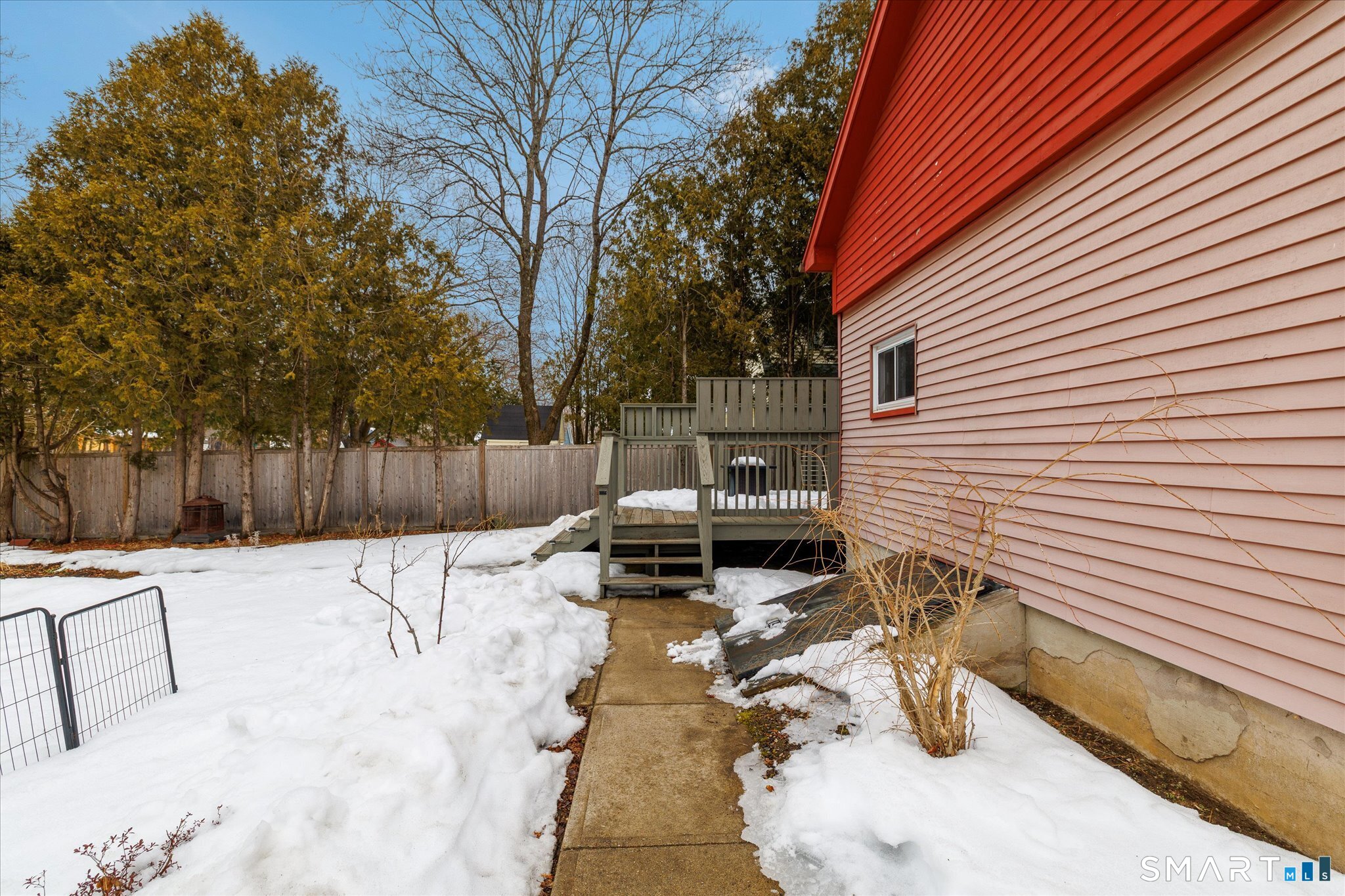 119 Quercus Avenue Windham, CT 06226 - Photo 21 of 30 a view of backyard with a table and chairs and wooden fence