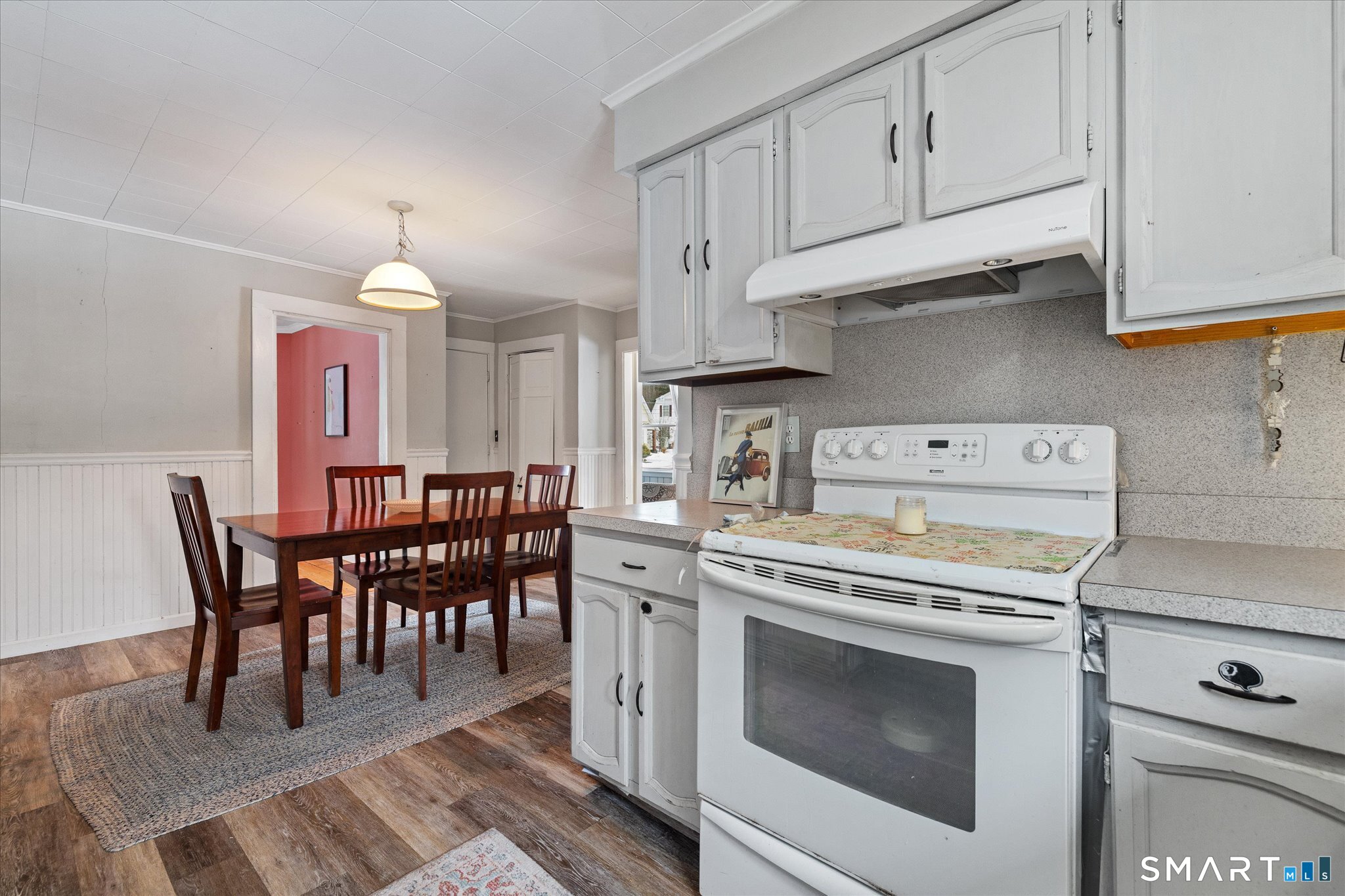 119 Quercus Avenue Windham, CT 06226 - Photo 27 of 30 a kitchen with a stove a table and chairs