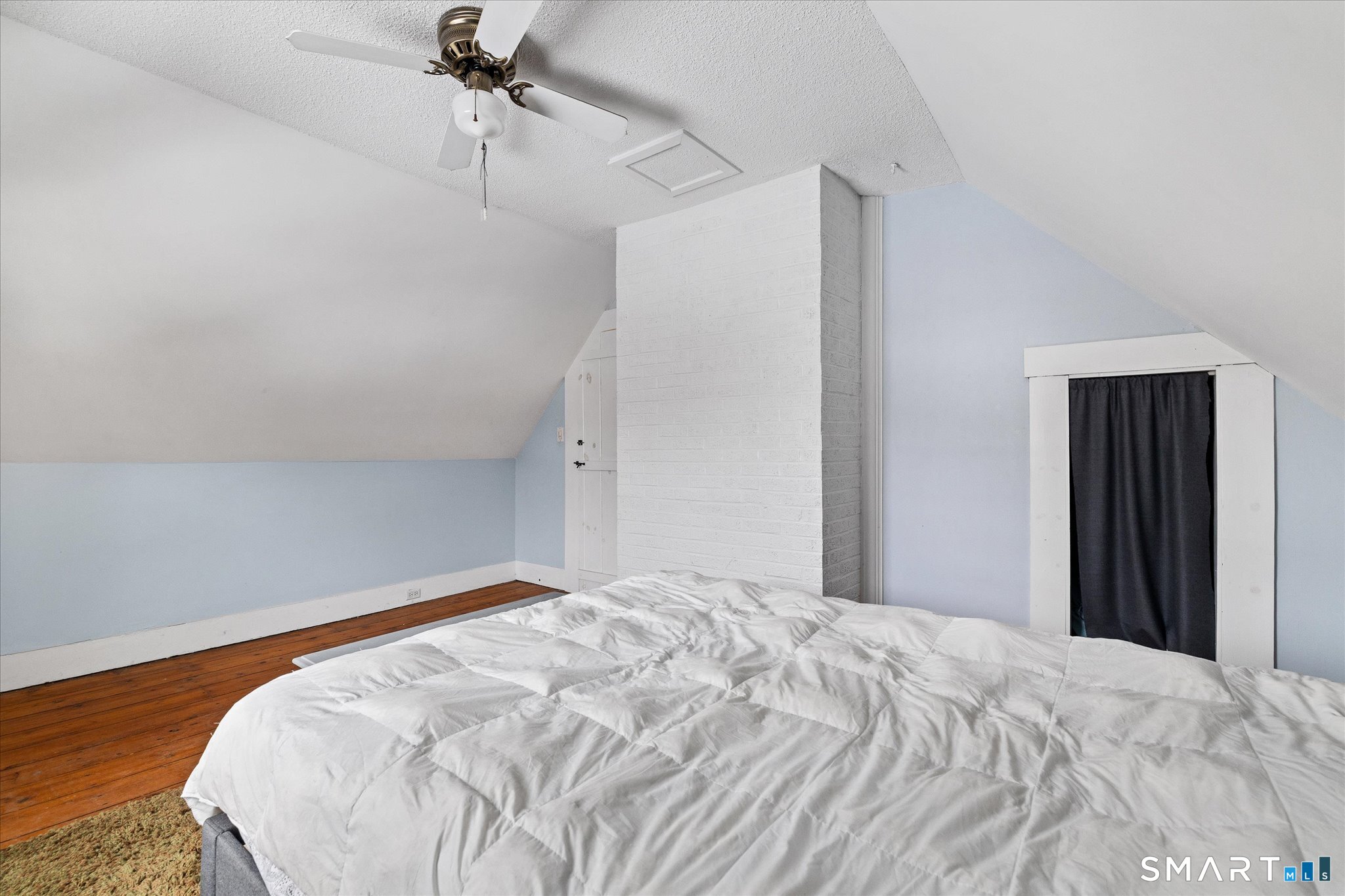 119 Quercus Avenue Windham, CT 06226 - Photo 30 of 30 a bedroom with a bed and a chandelier