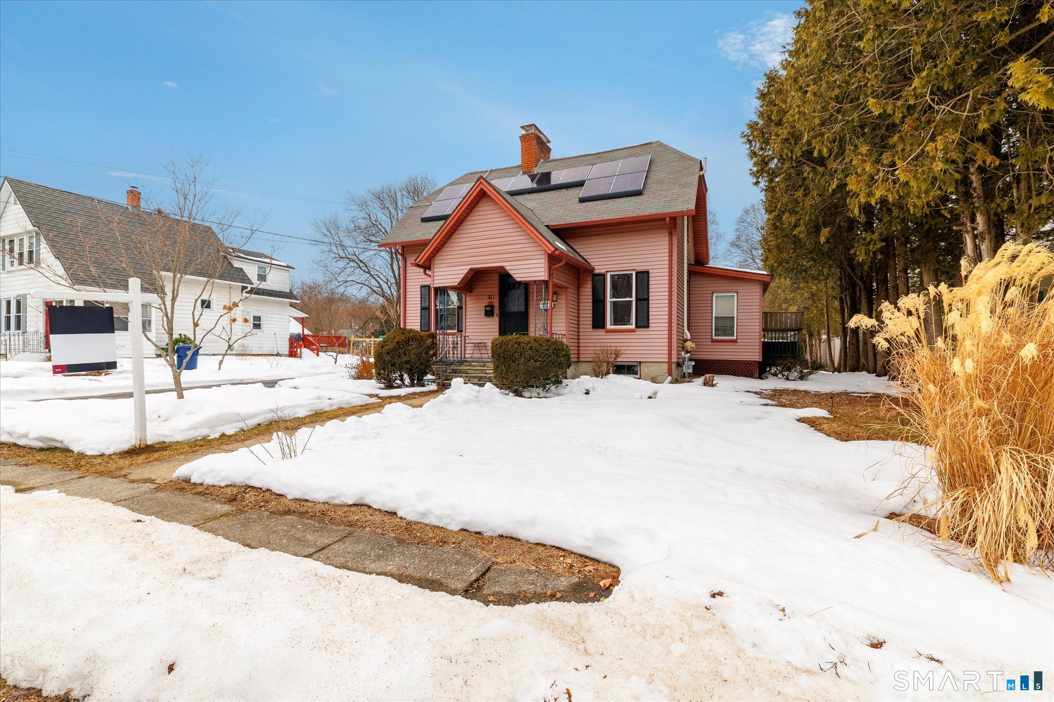 119 Quercus Avenue Windham, CT 06226 - Photo 4 of 30 a view of a white house with a yard covered in snow