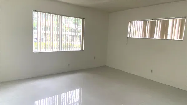 an empty room with windows