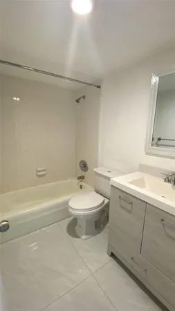 a bathroom with a sink a toilet and a bathtub