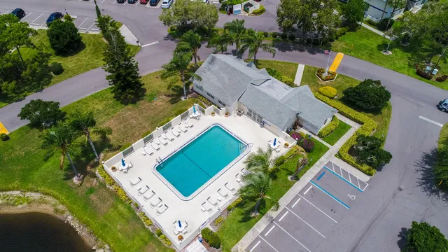 an aerial view of a house with a garden and swimming pool