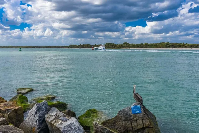 a view of a house with iron fence