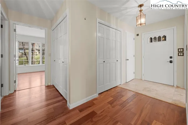 a view of a room with a ceiling fan and a window