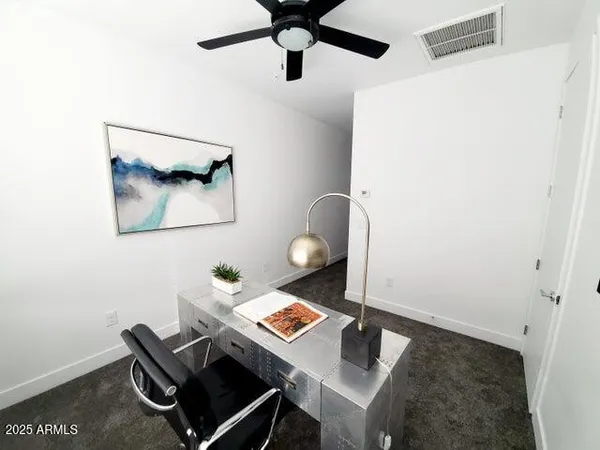 a living room with furniture and a rug