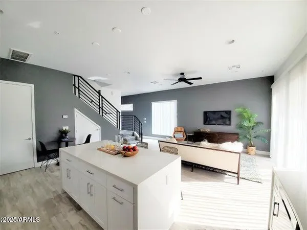 a kitchen with a sink appliances and cabinets