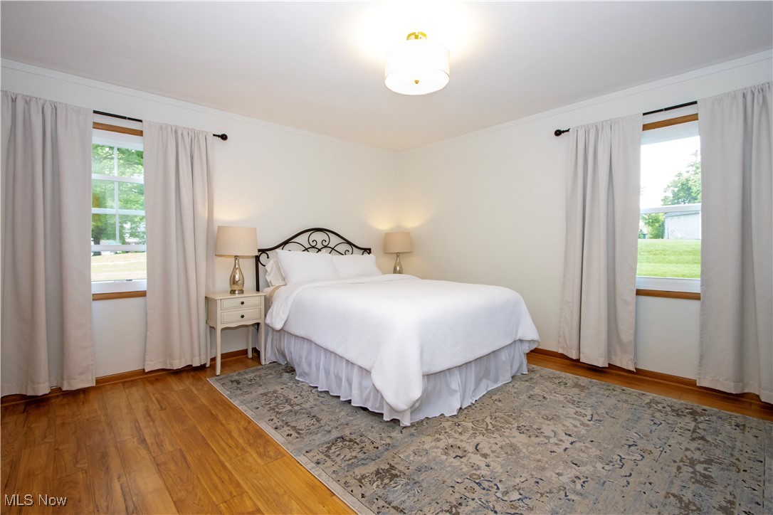 416 East Beverly Road Wooster, OH 44691 - Photo 26 of 36 Bedroom with wood finished floors and ornamental molding