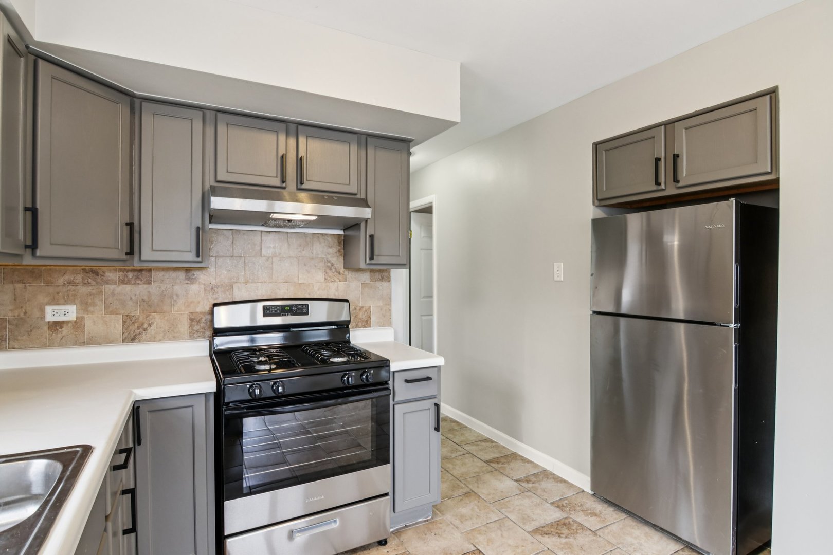 270 Madison Avenue Calumet City, IL 60409 - Photo 11 of 34 a kitchen with appliances cabinets and a counter top space