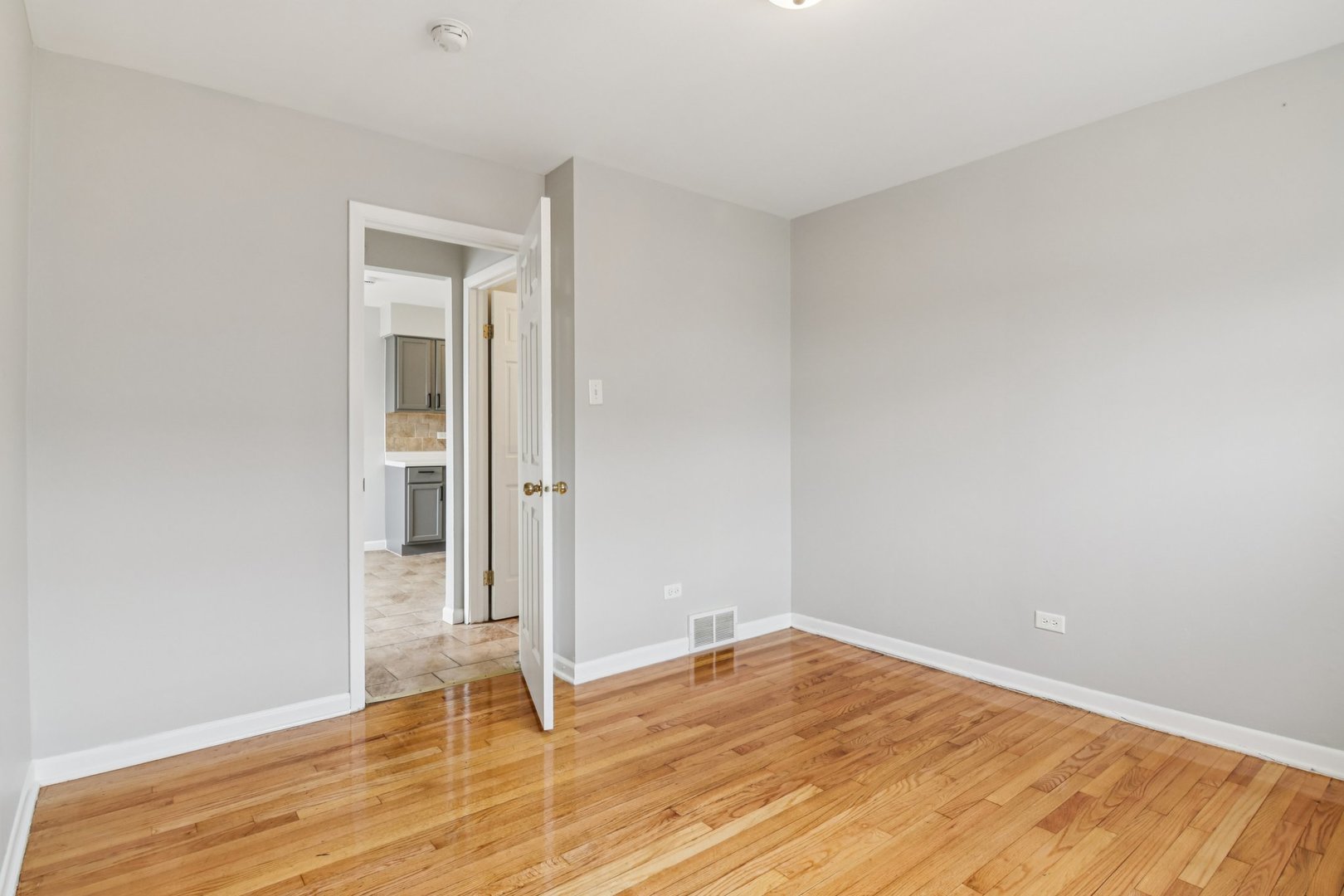 270 Madison Avenue Calumet City, IL 60409 - Photo 21 of 34 an empty room with wooden floor and entrance