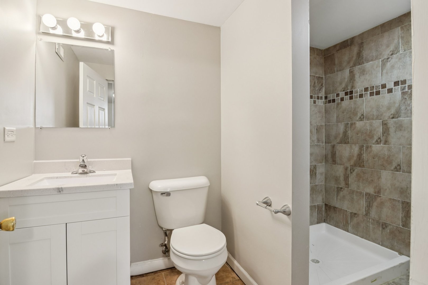 270 Madison Avenue Calumet City, IL 60409 - Photo 22 of 34 a bathroom with a granite countertop sink toilet a mirror and shower