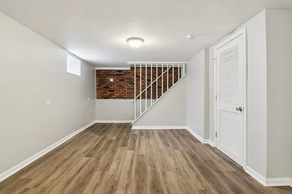 a view of an entryway with wooden floor