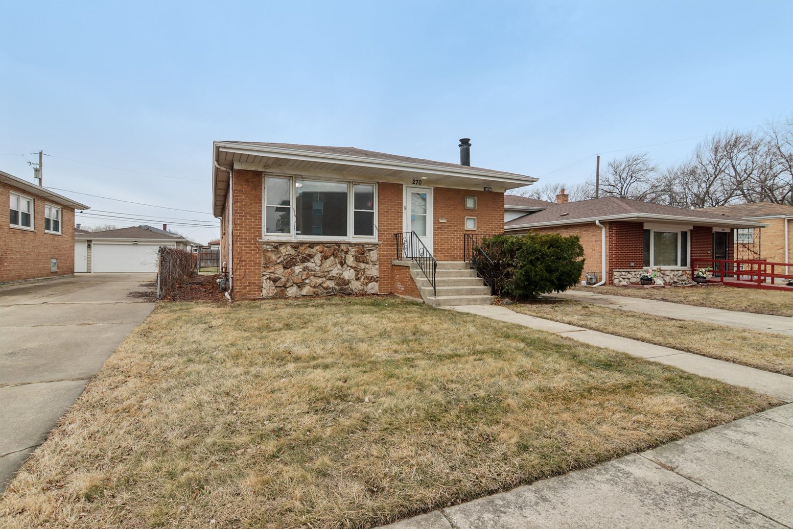 270 Madison Avenue Calumet City, IL 60409 - Photo 3 of 34 a front view of a house with garden