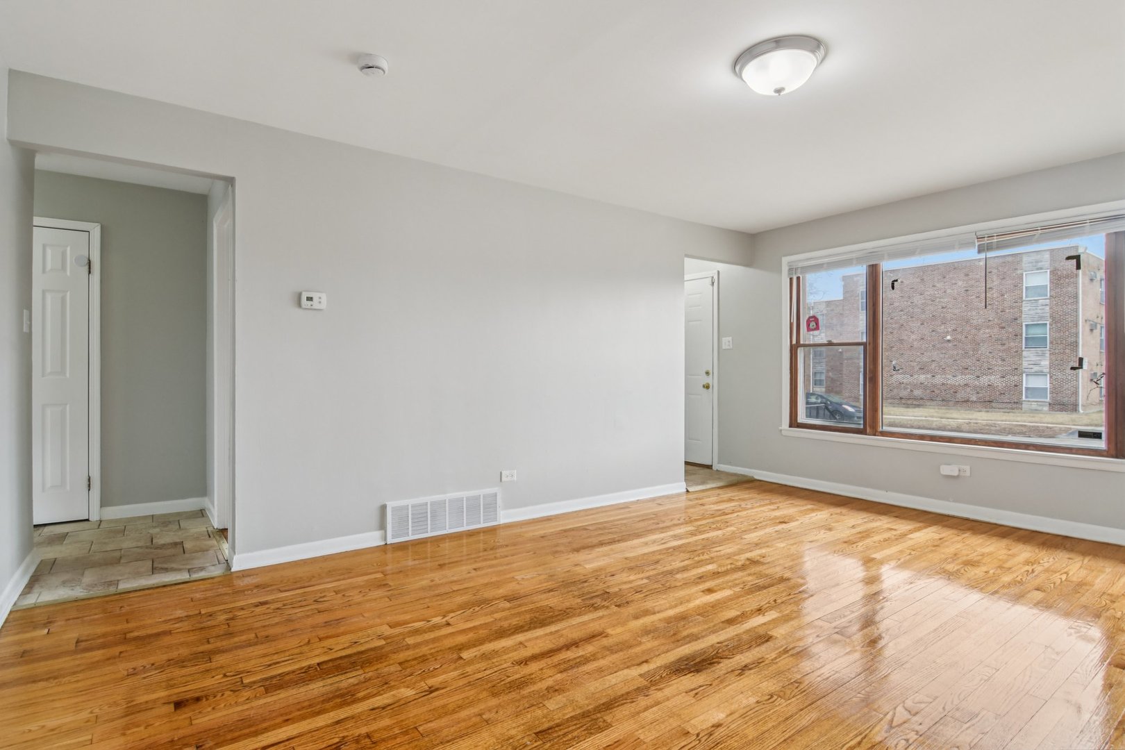 270 Madison Avenue Calumet City, IL 60409 - Photo 7 of 34 a view of an empty room with a window
