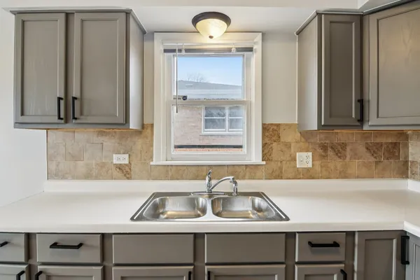 a kitchen with appliances cabinets and a counter top space