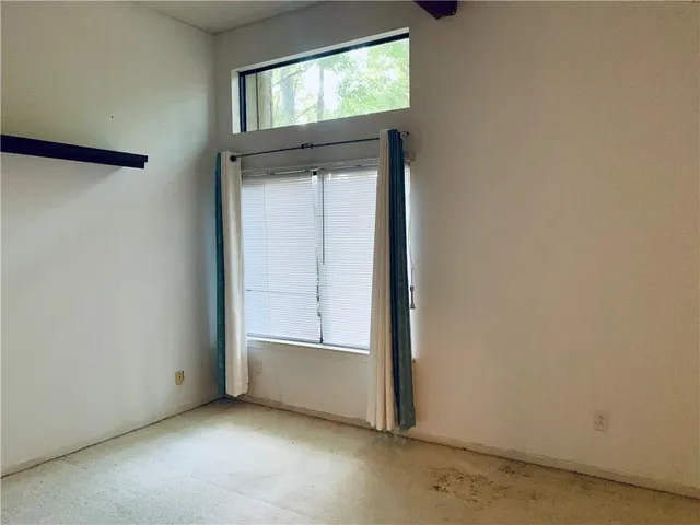 an empty room with window