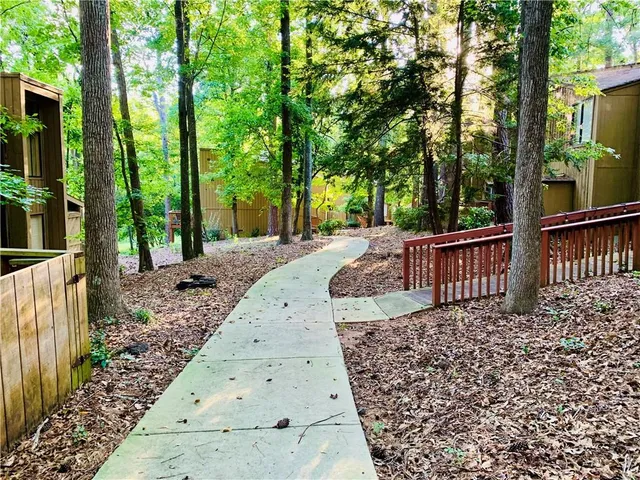 a view of a backyard with a large tree