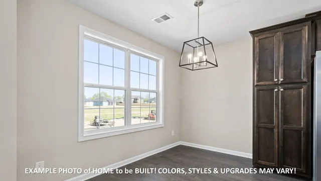a view of a room with window and hallway