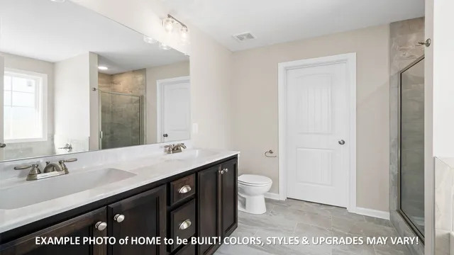 a bathroom with a shower and a bath tub