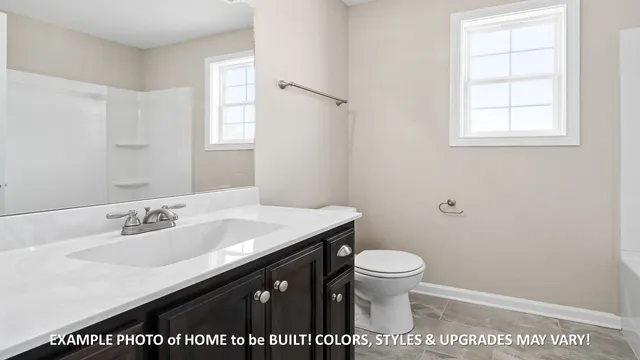 a view of a livingroom with a ceiling fan and window